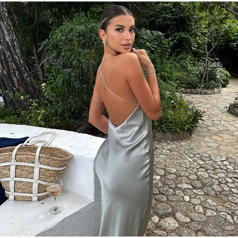 Stylish women's sleeveless evening gown with an elegant open back, perfect for formal events.
