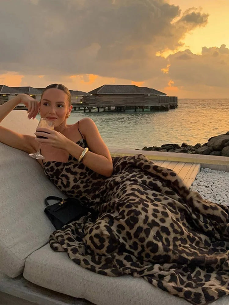 Stylish women's long leopard print maxi dress, an eye-catching statement piece for formal events & parties.