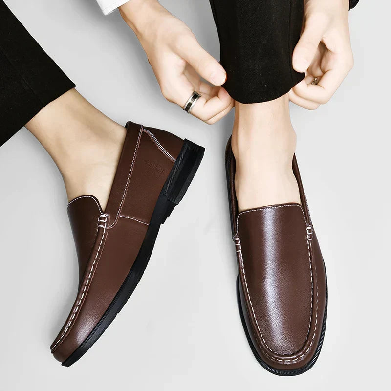 Elegant men's classic black loafers, slip-on design for effortless style and comfort.