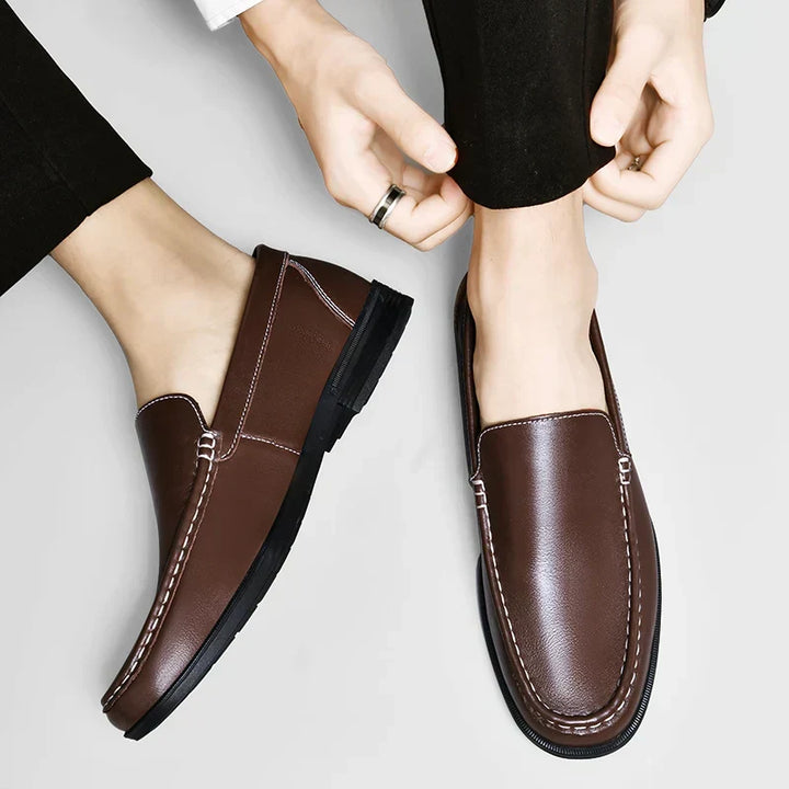 Elegant men's classic black loafers, slip-on design for effortless style and comfort.