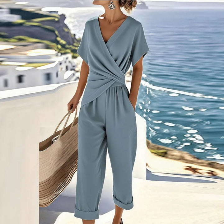 Breathable women's wrap top and cropped pants set; a versatile two-piece outfit for elegant summer or casual occasions.
