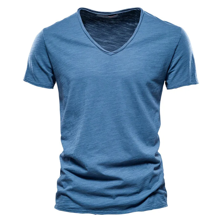 Effortless style: Men's V-neck summer shirt, relaxed fit, short sleeve. Great for warm weather, vacation, & daily comfort.
