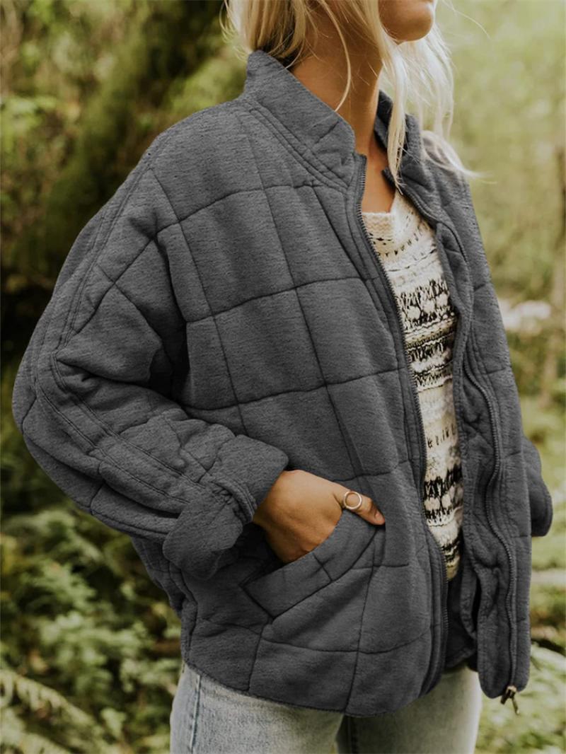 Women's stylish quilted jacket with a zipper, perfect for everyday wear and versatile fall fashion.