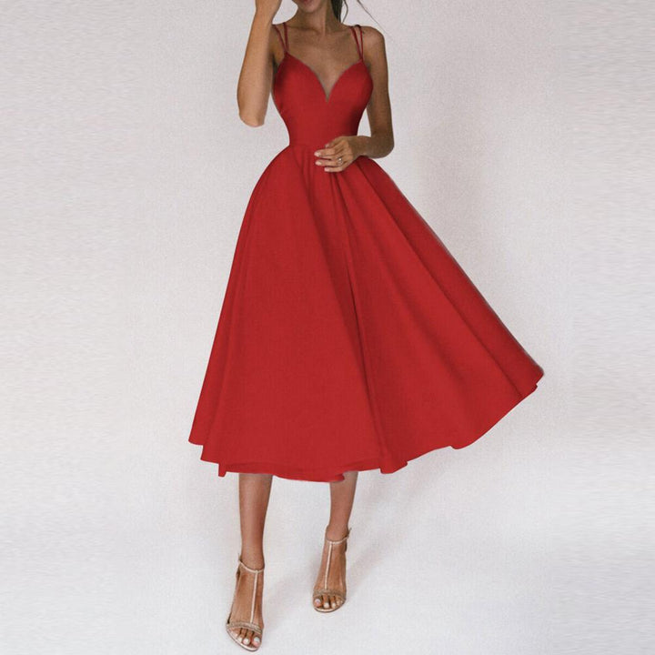 Women's elegant A-line midi dress showcasing a structured bodice & a flowing flared skirt, a chic choice for evening wear.