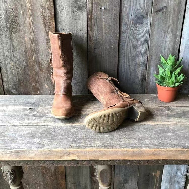 Everyday elegant brown mid-calf boots for women, featuring a stylish side zip and sturdy block heel. Winter-ready.