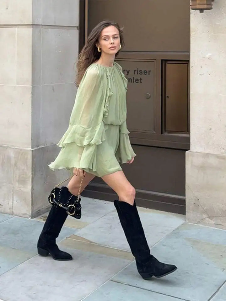 Dreamy flowing tiered mini dress for women. Stylish and comfortable summer wear, relaxed fit.