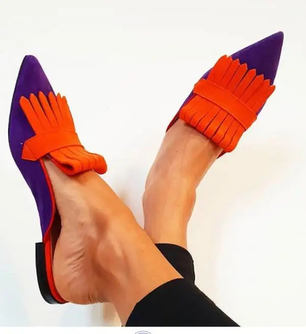 Classic open-back pumps with a pointed toe, an essential elegant women's shoe for any wardrobe.