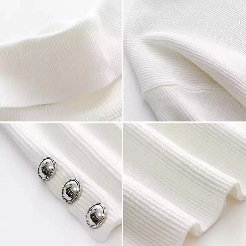 Fashionable women's ribbed turtleneck sweater with chic button sleeves. An elegant long-sleeve knit for all seasons.