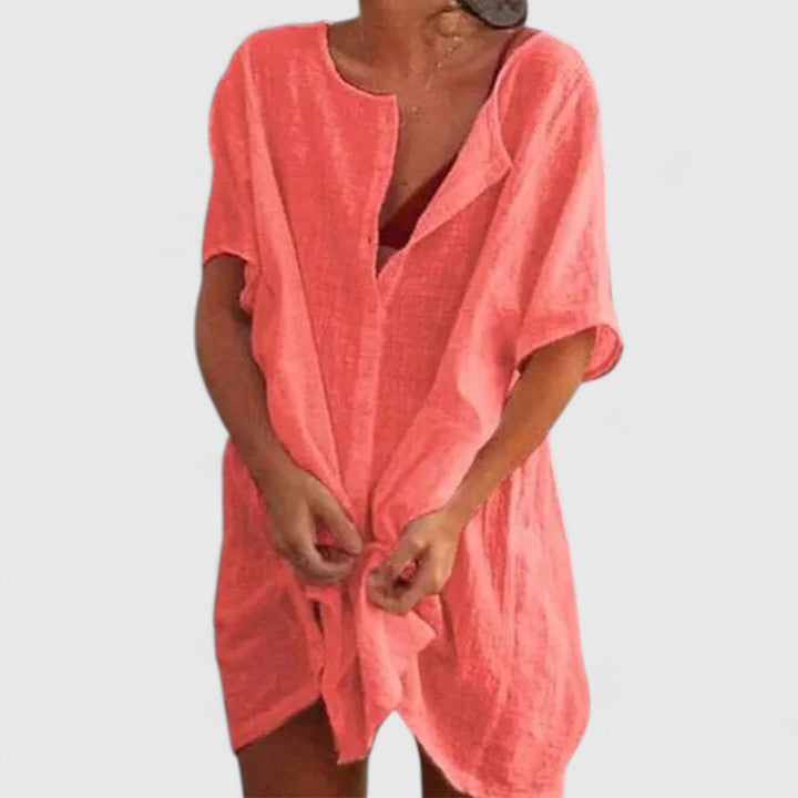 Stylish women's summer tunic dress in a vibrant color, designed for elegant and comfortable casual wear. Fashion.