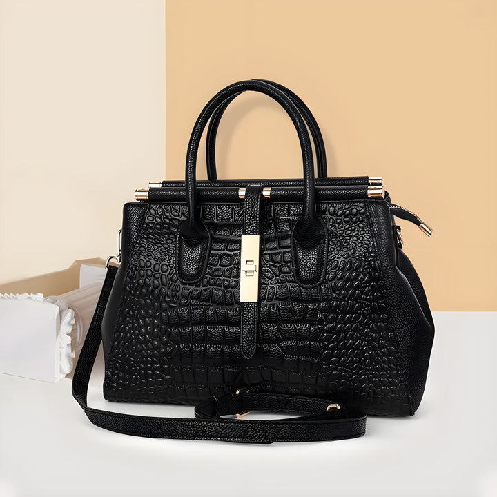 Versatile ladies' structured handbag with elegant alligator texture, spacious interior & shoulder strap.