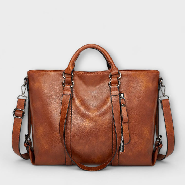 Classic women's large brown leather shoulder bag, perfect for everyday carry.