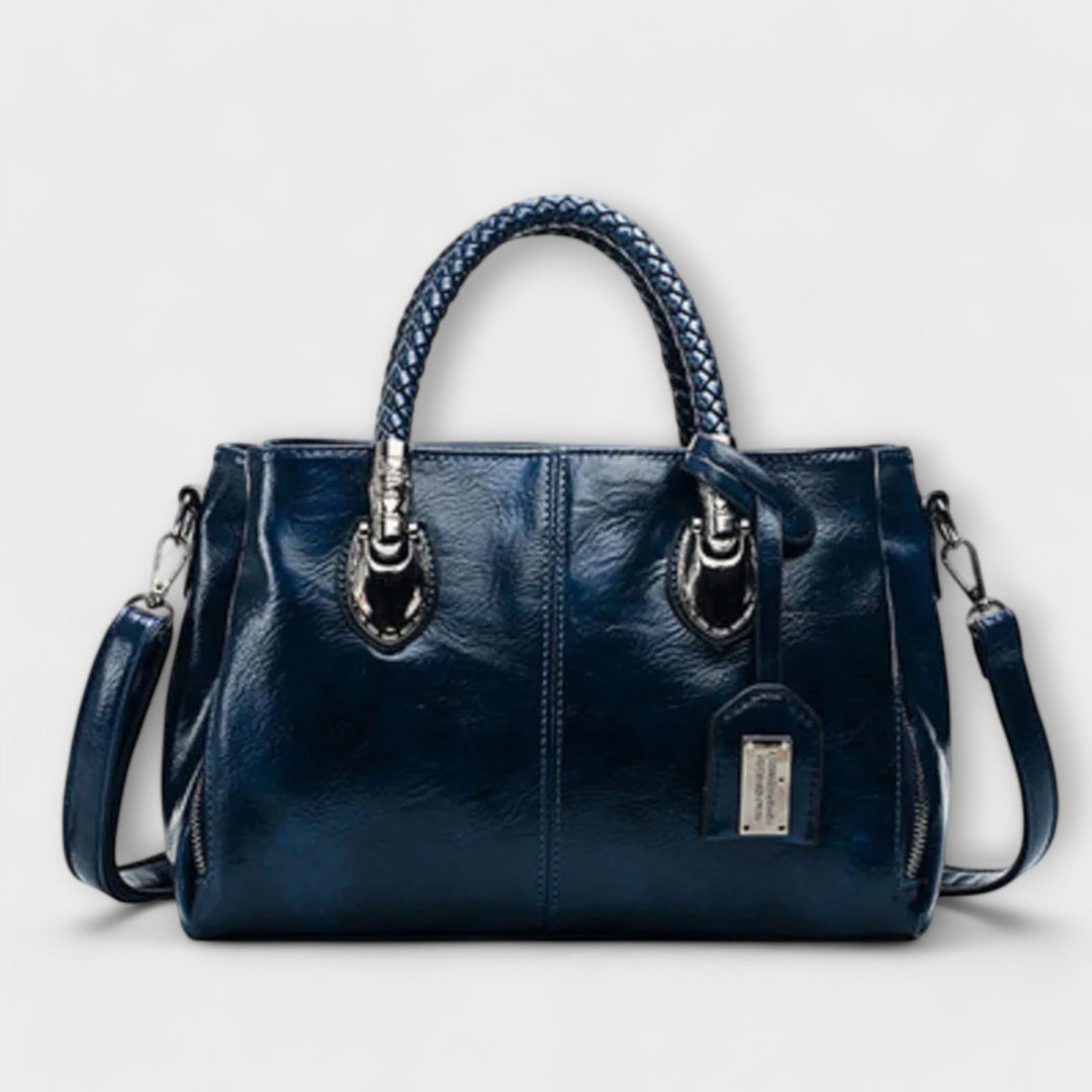 Classic unisex leather duffle bag with elegant design. Ideal for weekend getaways & work essentials.