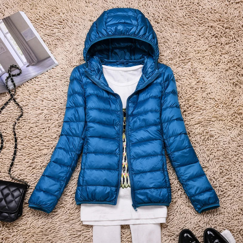 Women's lightweight winter coat, insulated & hooded. Comfortable, packable outerwear for cold days.