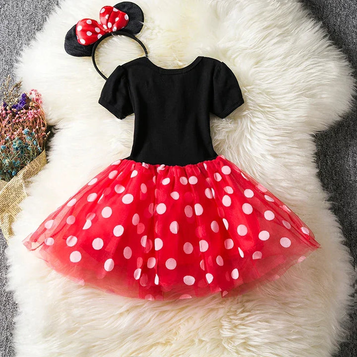 Vibrant red polkadot Minnie Mouse dress with puff sleeves & white accents for girls' parties.