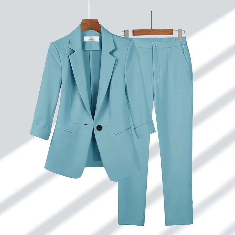 Close-up of a women's elegant suit blazer, detailing the lapel & fabric. Ideal for formal business attire.