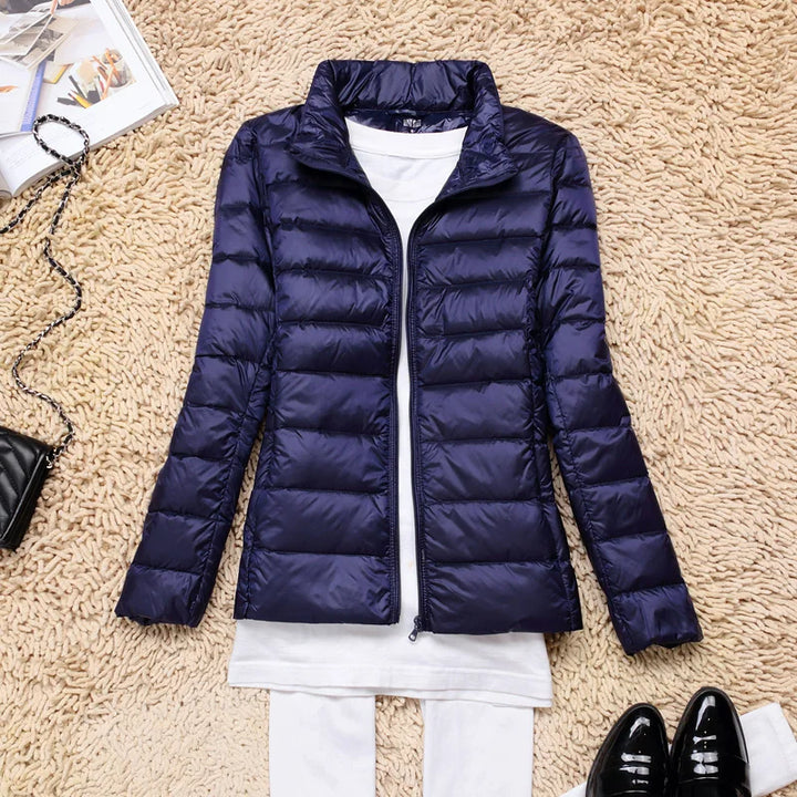 Comfortable women's hooded insulated jacket, lightweight. Perfect winterwear, packable & stylish.