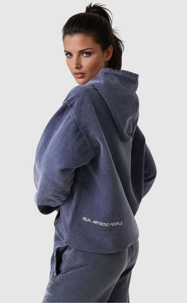 Comfortable women's relaxed fit oversized hoodie with a unique vintage wash and eye-catching graphic design.