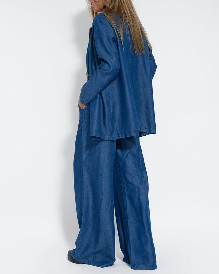 Women's sophisticated wide leg trousers and vest two-piece ensemble, perfect for modern style.