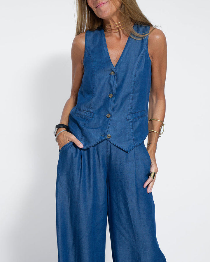 Model wearing women's chic 2-piece set: wide leg pants and tailored vest, summer fashion.