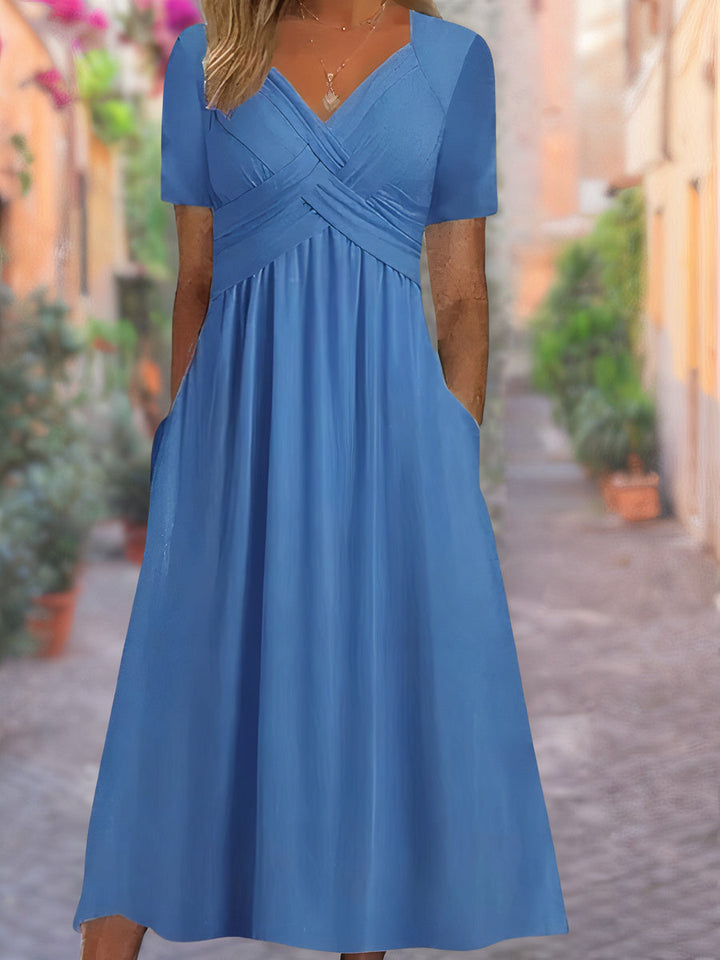 Elegant V-neck women's midi dress with tummy control. Comfortable, sleeveless, perfect for casual or dressed-up summer wear.