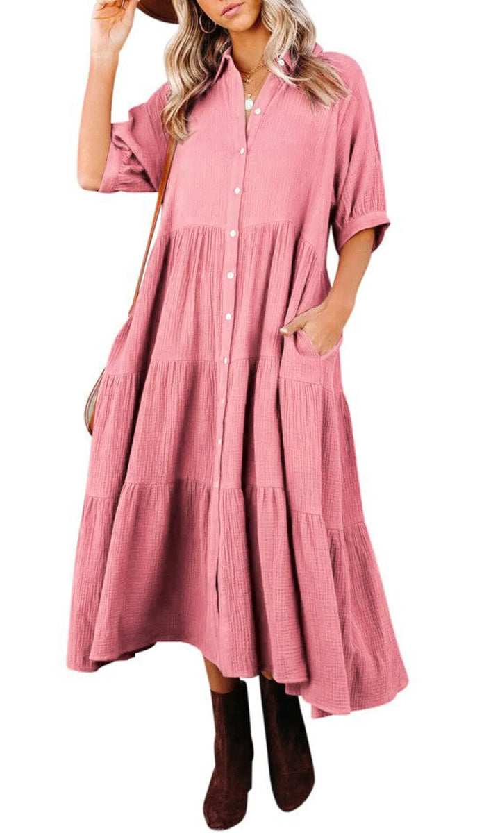 Flattering women's midi dress, perfect for summer, featuring a comfortable fit and discreet pockets.