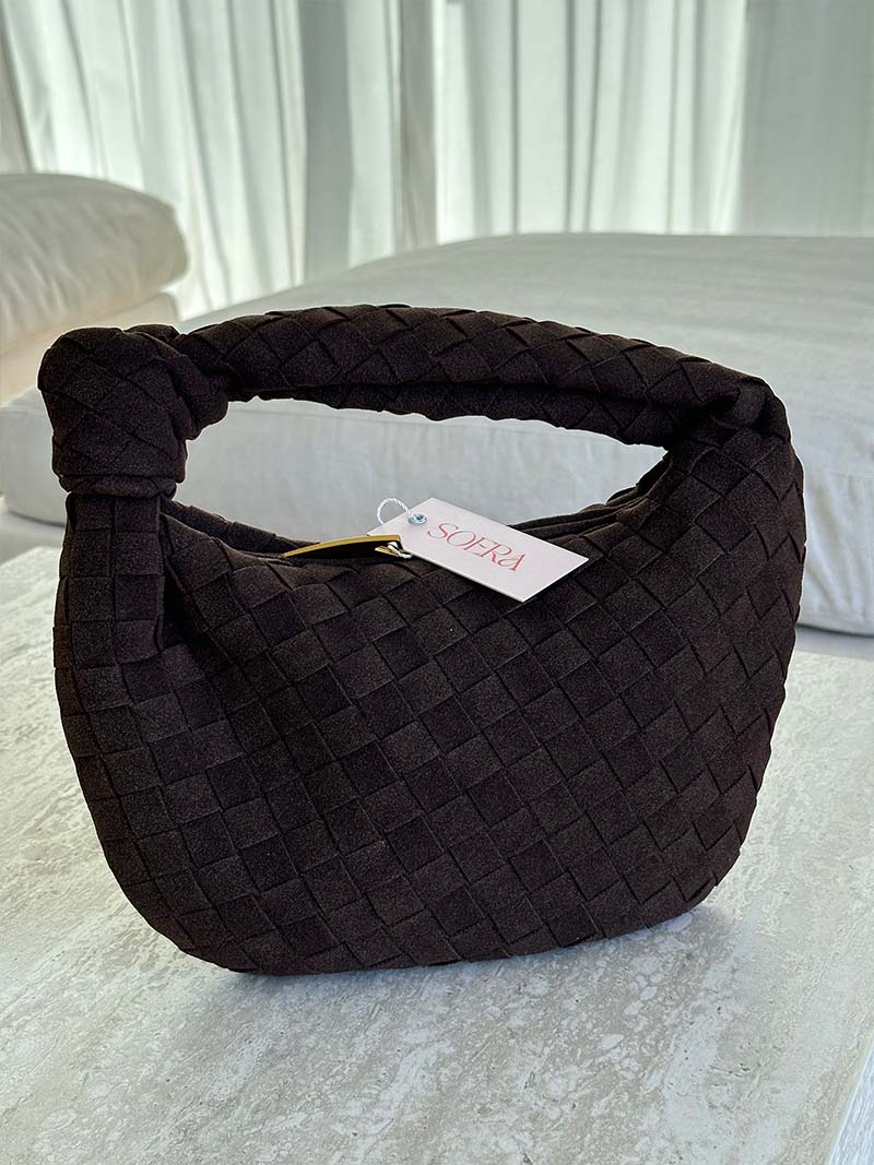 Women's stylish everyday bag: compact braided suede design for convenience.
