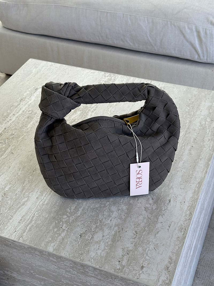 Elegant braided mini bag for women, meticulously crafted from soft suede.