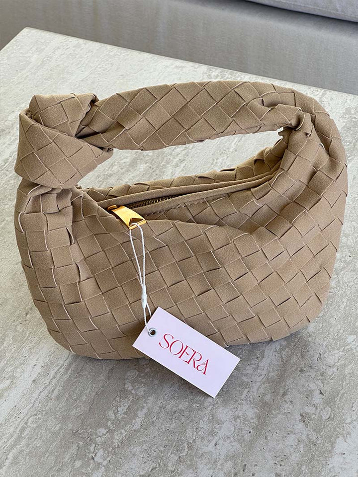 Stylish women's accessory: compact braided suede shoulder bag for convenience.
