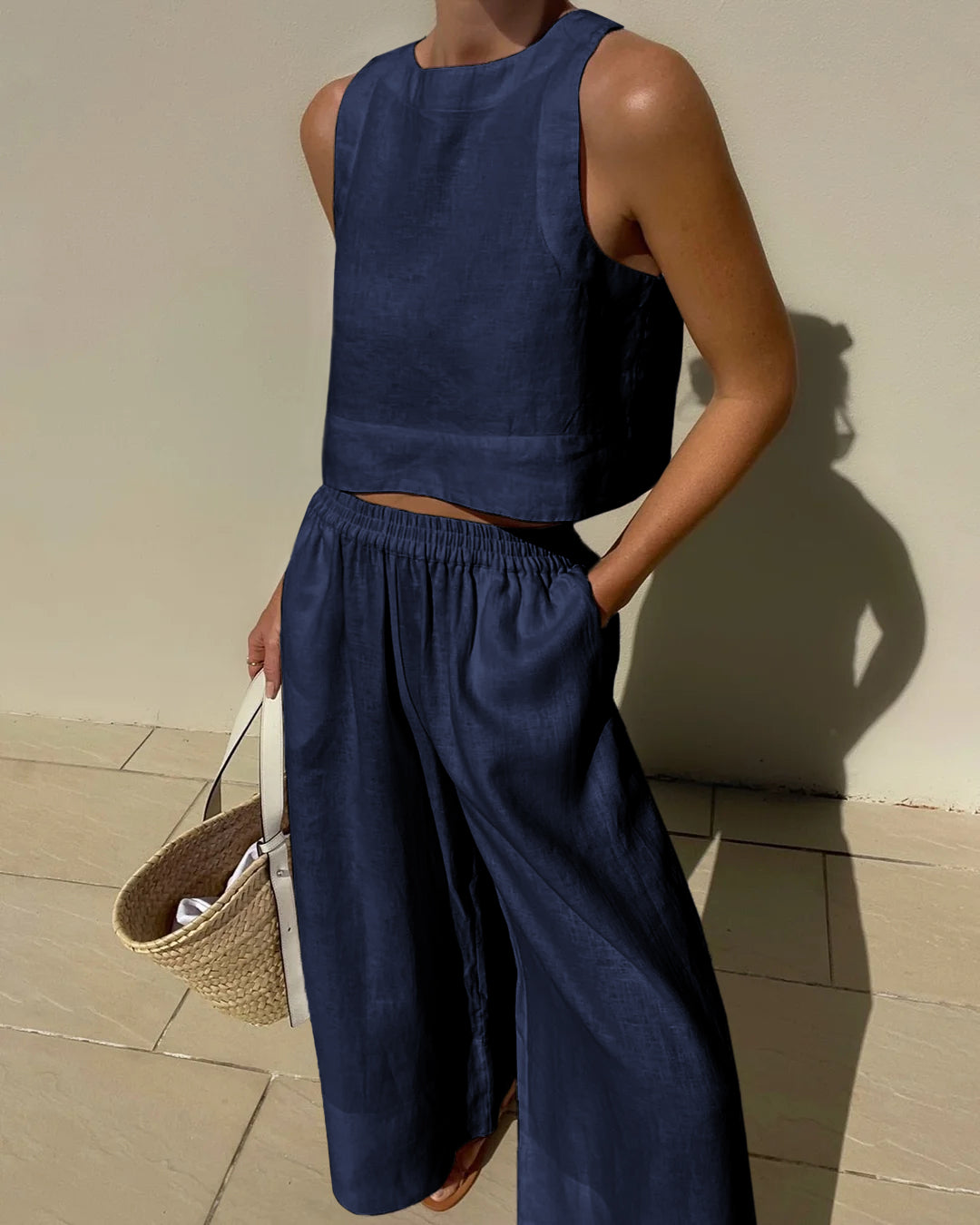 Effortless women's two-piece set with crop top & wide-leg pants, ideal for elegant summer fashion & resort wear.