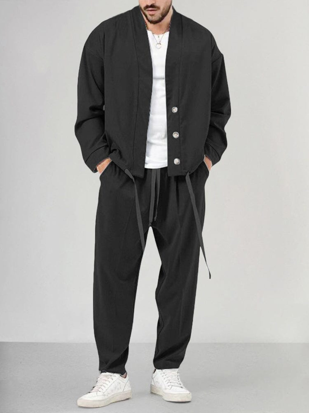 Black men's 2-piece knit lounge set, a comfortable and casual wear outfit with relaxed fit and elastic waist.