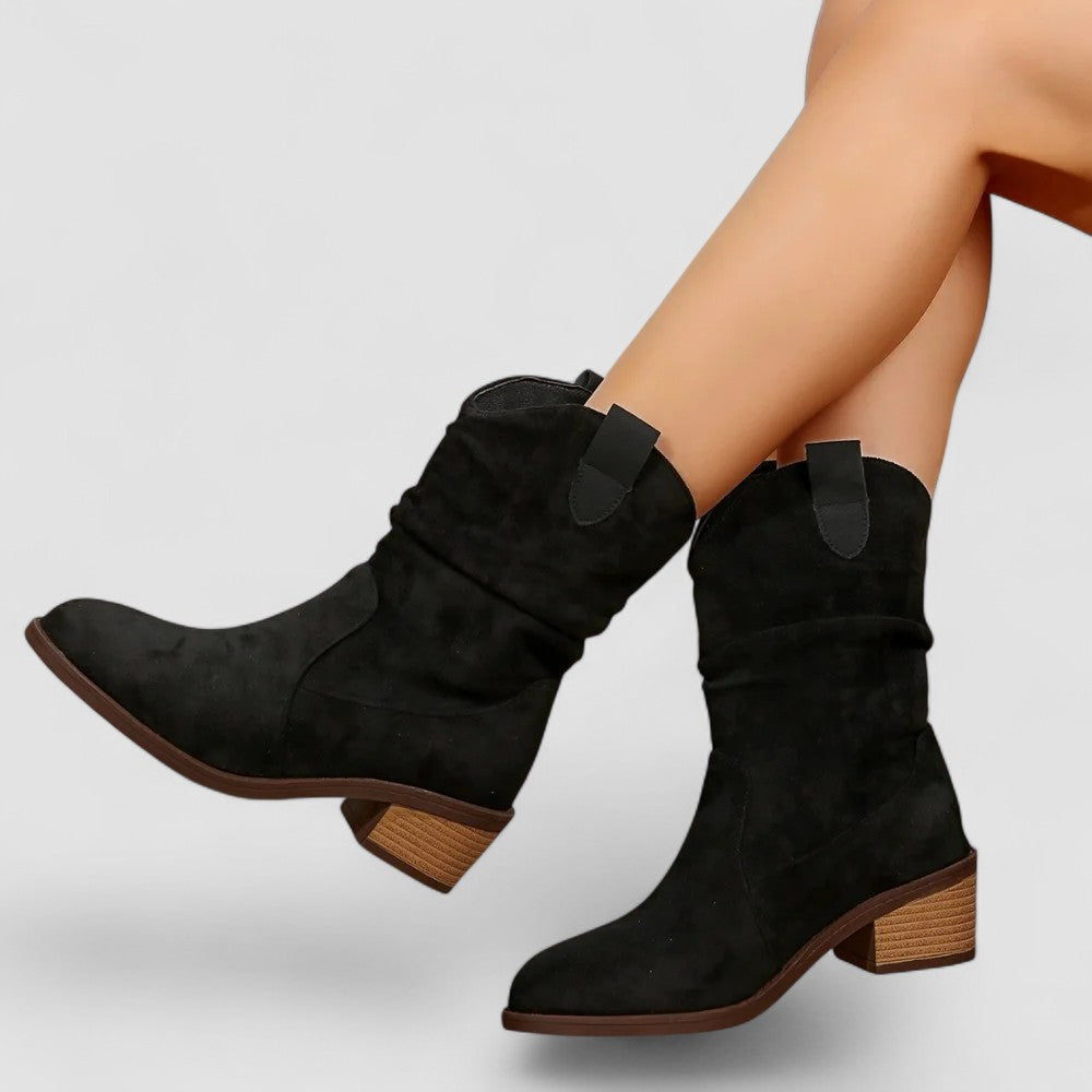 Casual women's mid-calf slouch boots with easy pull tabs, low heel, and comfortable rounded toe design.