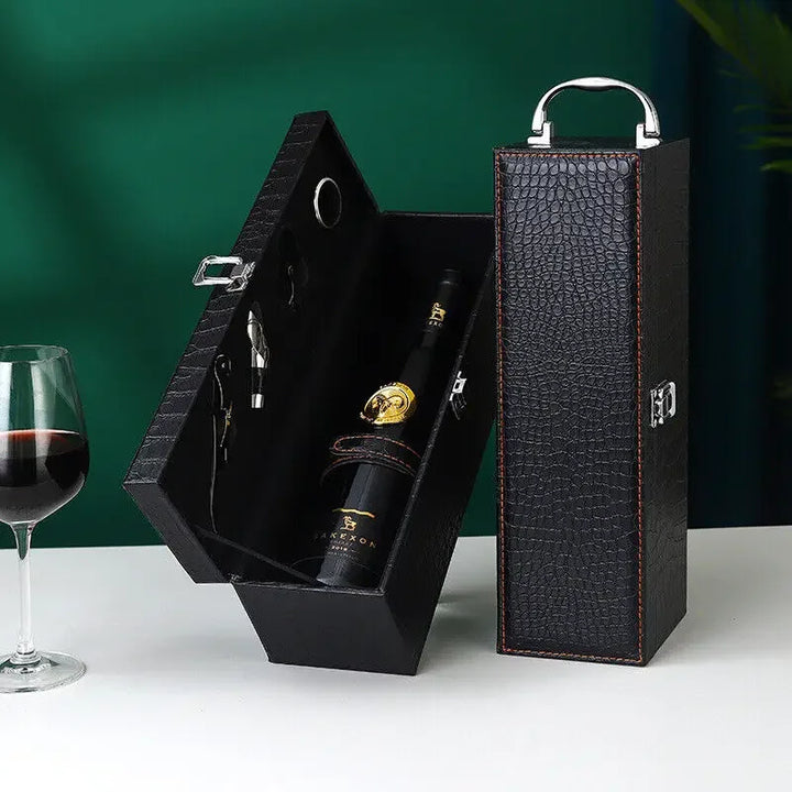 Open luxury wine case revealing compartments for two bottles and integrated accessories.
