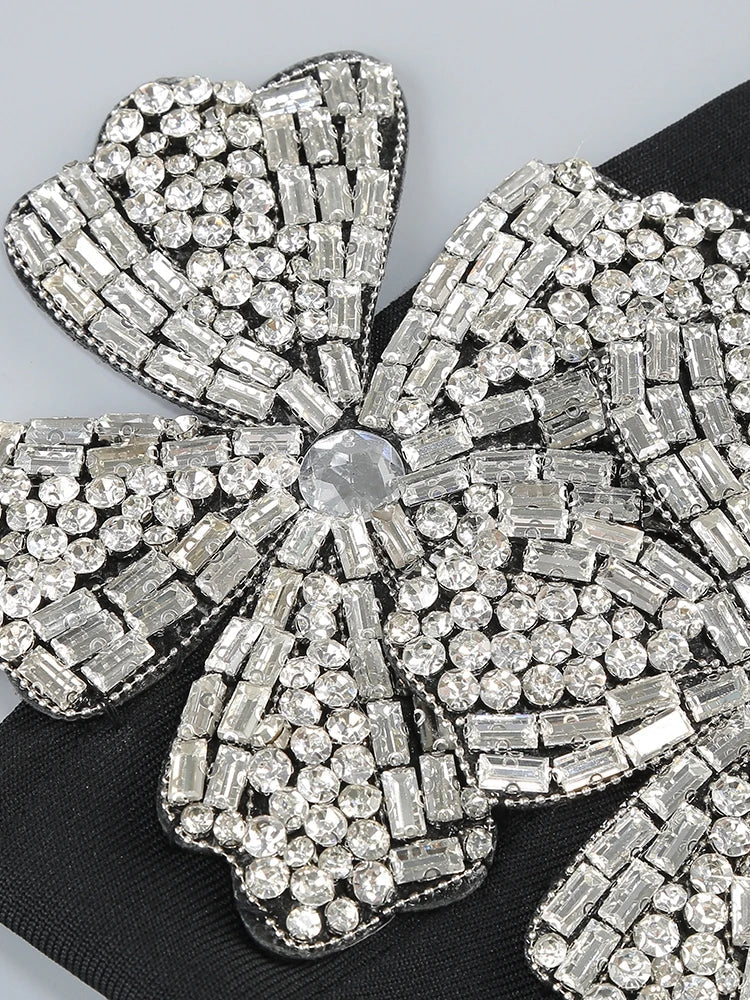 Stylish women's embellished high-waisted two-piece set for elegant parties and festive holiday events.