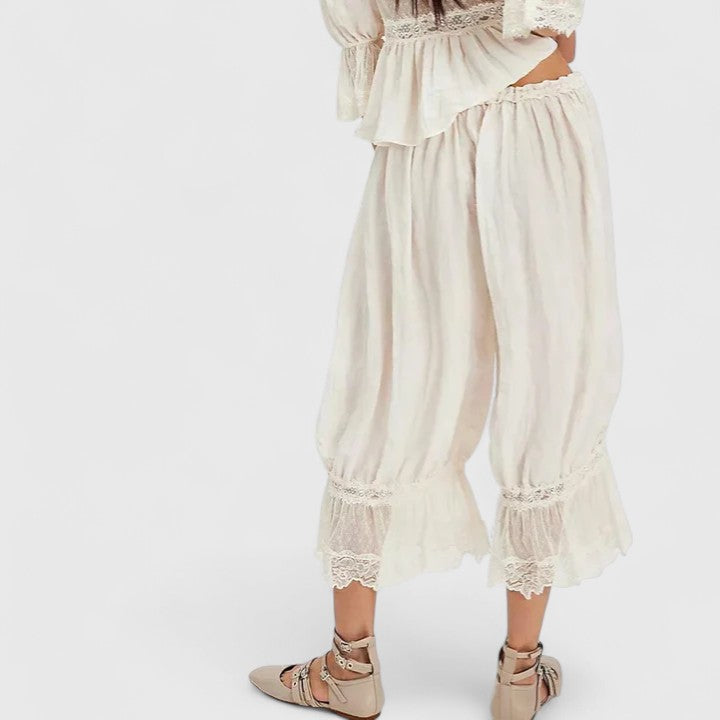 Detailed shot of the lace trim on the hem of women's comfortable patchwork casual trousers.