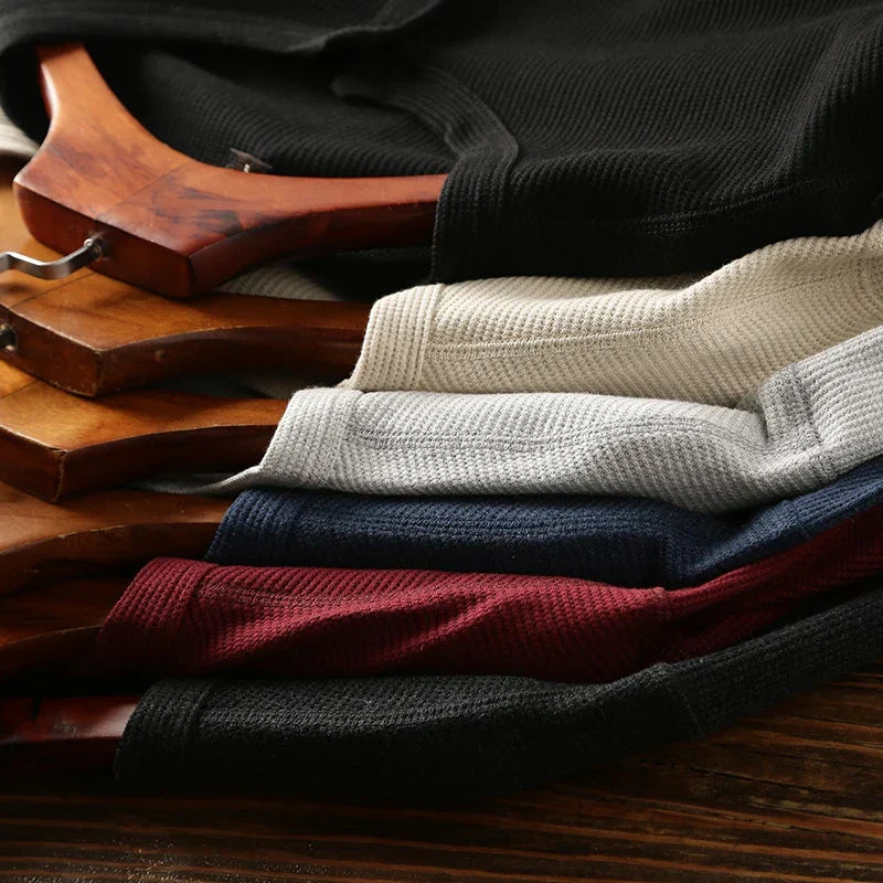 Minimalist men's henley shirt, featuring a comfortable waffle texture and smart casual appeal.