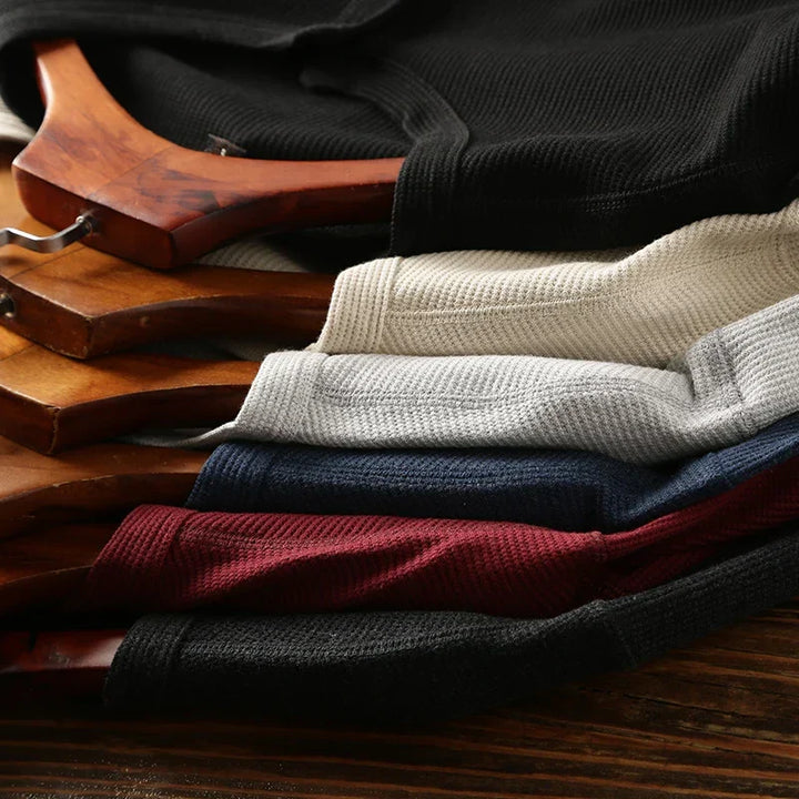Minimalist men's henley shirt, featuring a comfortable waffle texture and smart casual appeal.