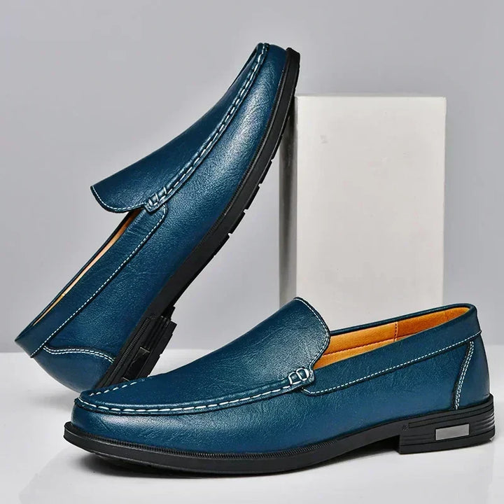 Crisp white men's slip-on loafers. Ideal for a refined casual look or summer elegant men's fashion.