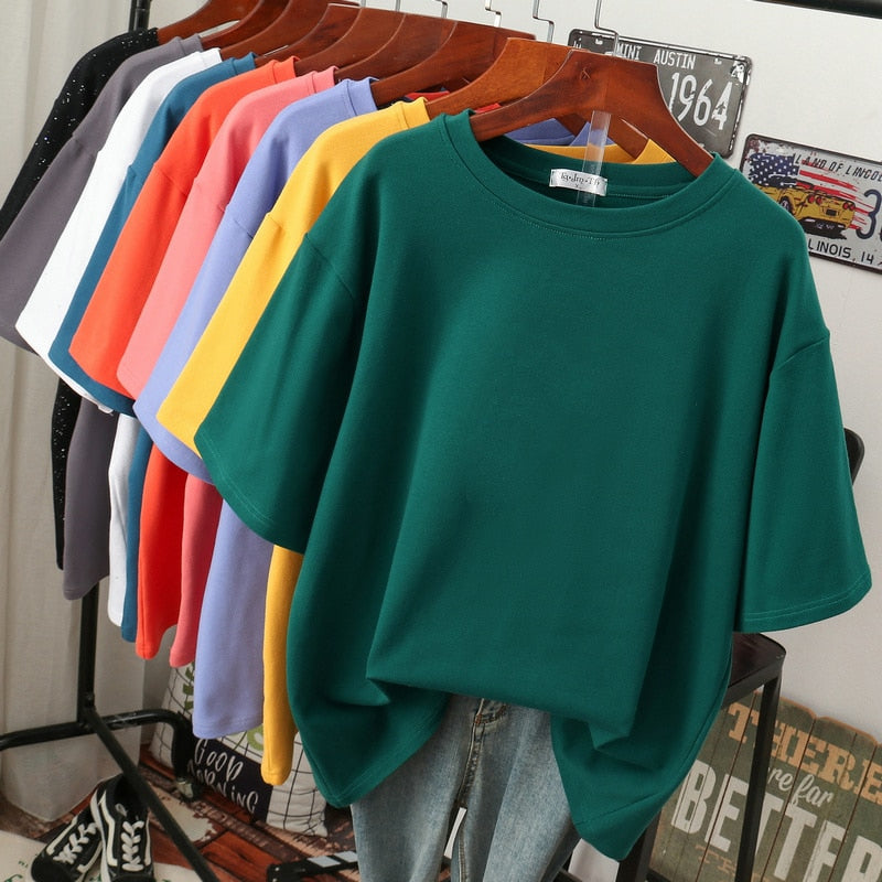 Plus-size woman models a comfy short-sleeve, round-neck t-shirt, showcasing its casual style & relaxed fit.