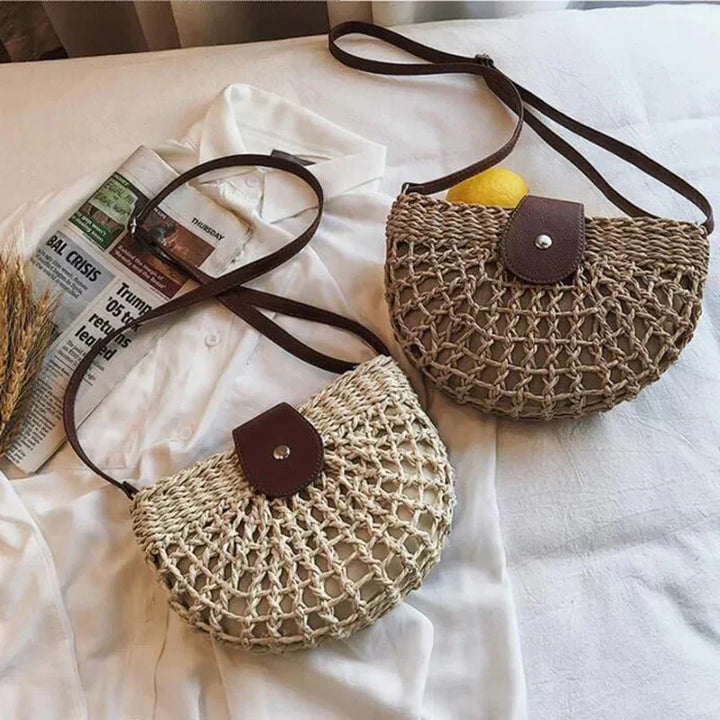 Stylish women's crossbody straw bag with intricate web design, a natural and lightweight choice for daily use.