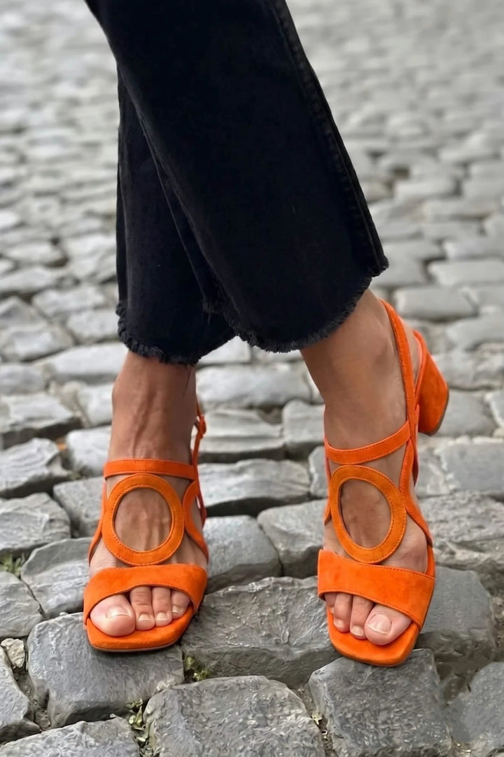 Comfortable women's block heel sandals with a modern ankle cut-out and elegant square toe. Great for any occasion.