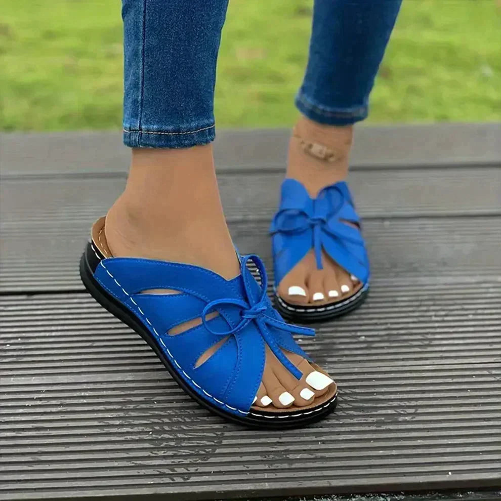 Classic women's wedge sandals with knot detail, designed for comfort and versatile summer styling.