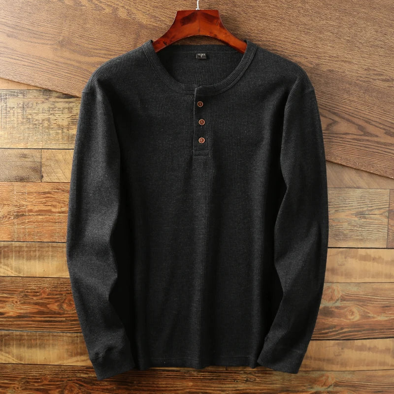 Versatile men's henley shirt with a distinctive waffle knit, perfect for smart casual outfits.