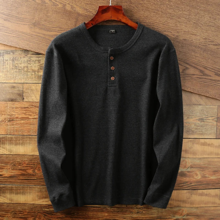 Versatile men's henley shirt with a distinctive waffle knit, perfect for smart casual outfits.