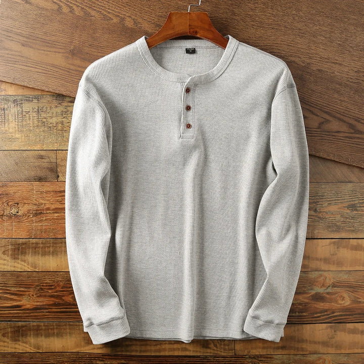 Smart casual men's henley in a versatile waffle knit, perfect for modern minimalist fashion.