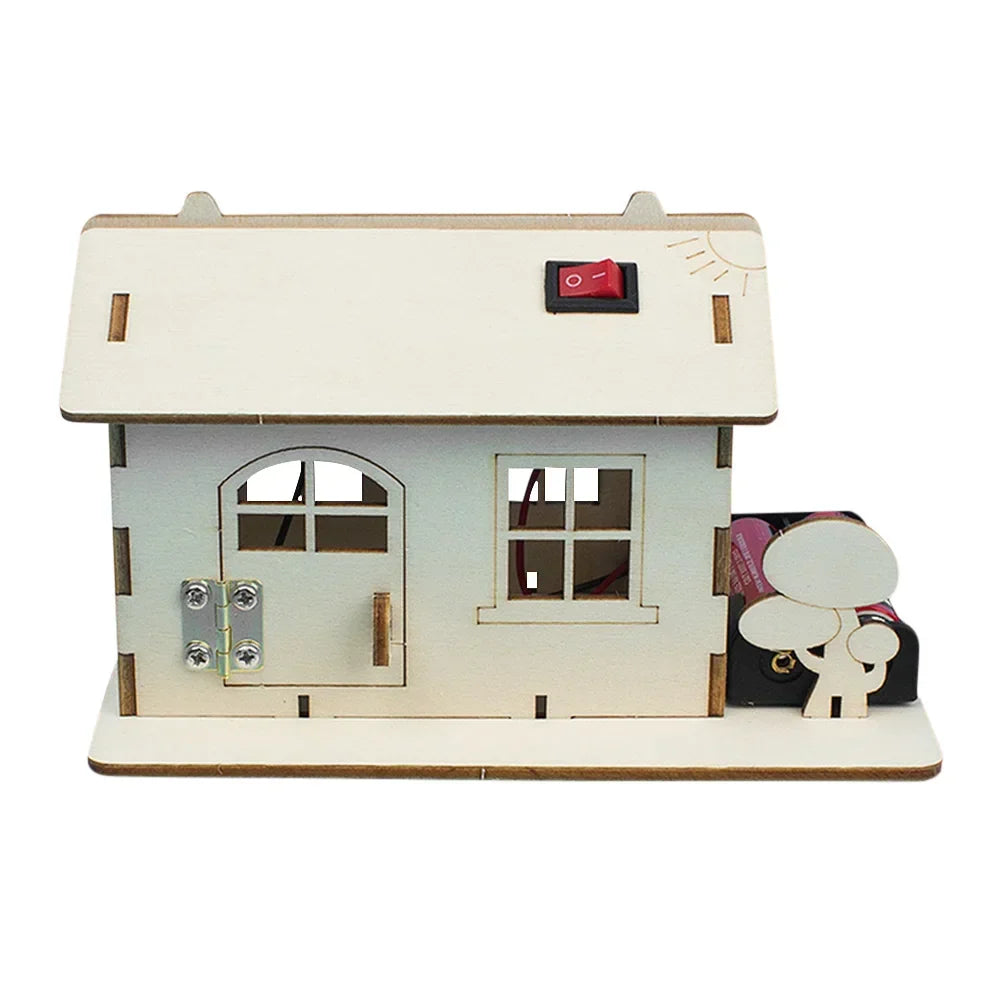 Wooden electric toy boat building kit in progress, showing wooden hull, motor, propeller.
