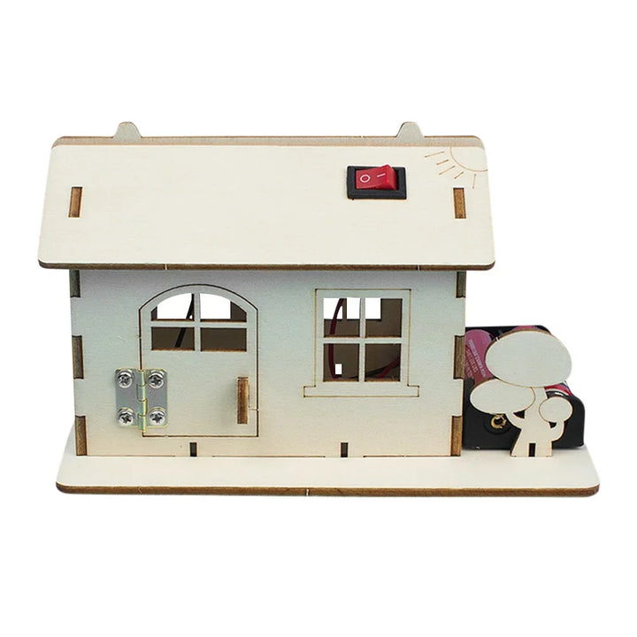Wooden electric toy boat building kit in progress, showing wooden hull, motor, propeller.