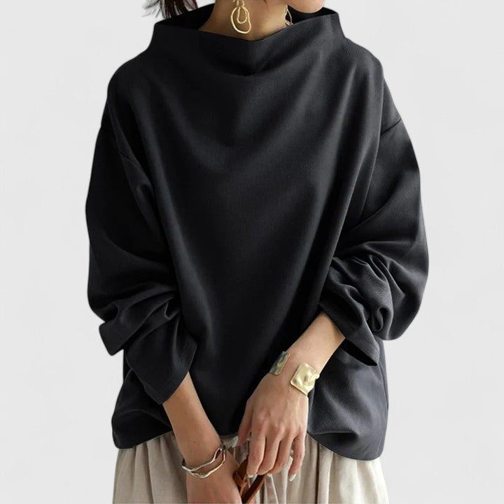 Fashionable high neck women's top, offering an elegant and comfortable silhouette. Versatile for any occasion.