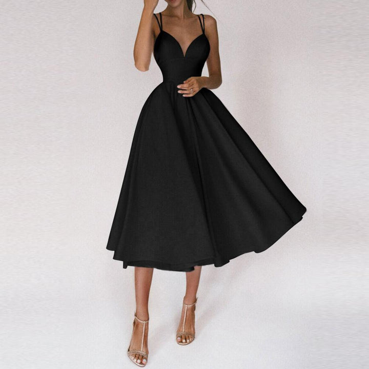 Comfortable & elegant women's midi dress. Features a structured bodice, flared skirt, and straps, ideal for any occasion.