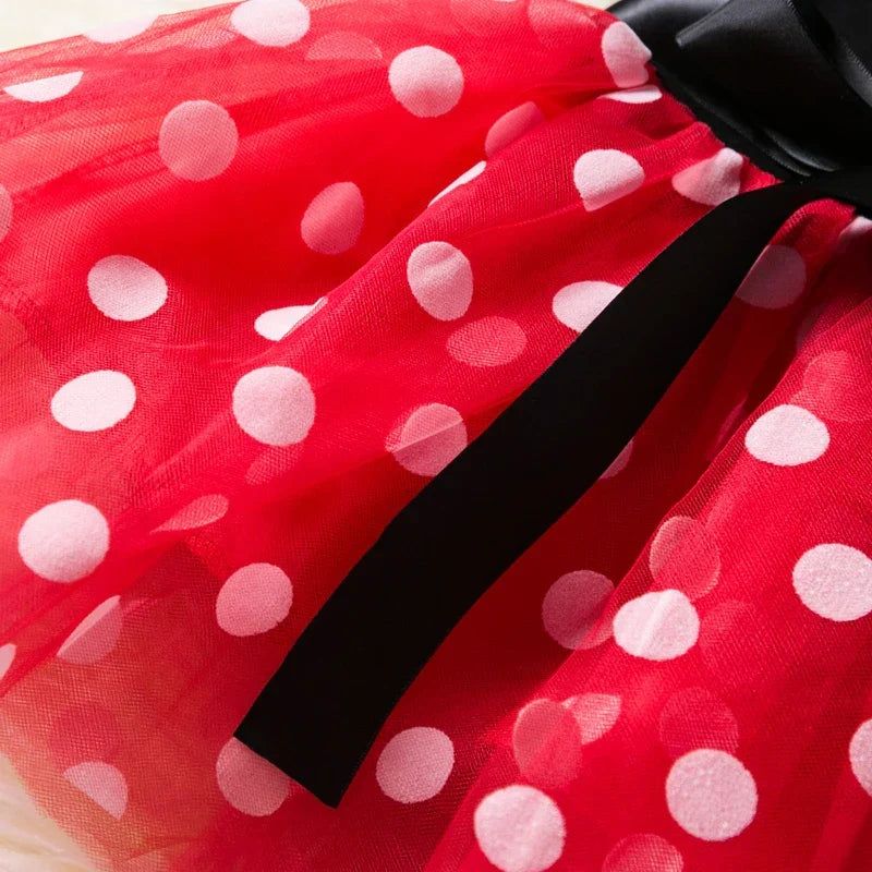 Iconic Minnie Mouse ears headband with a matching red polkadot bow for girls' dress-up.