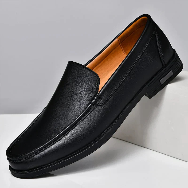 Classic black slip-on men's loafers for formal or casual effortless style & comfort.